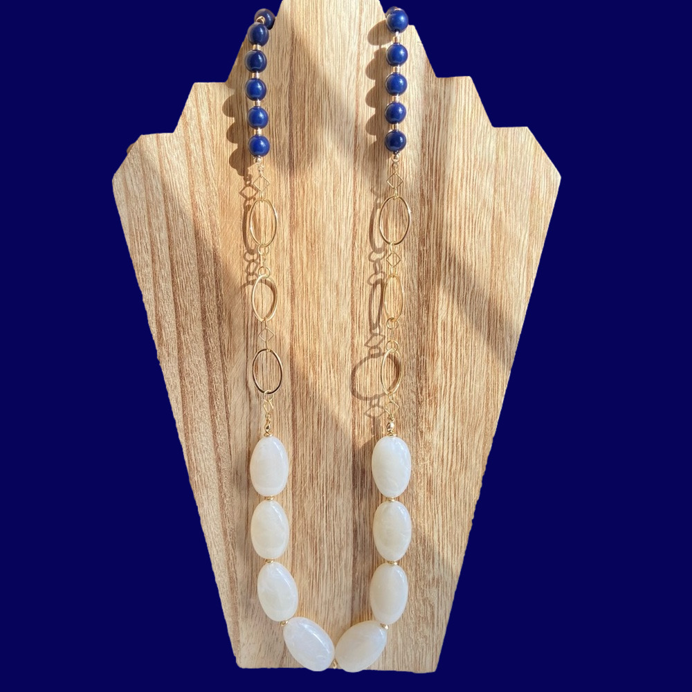 The Limited necklace in swirly cream lucite round navy beads and goldtone links